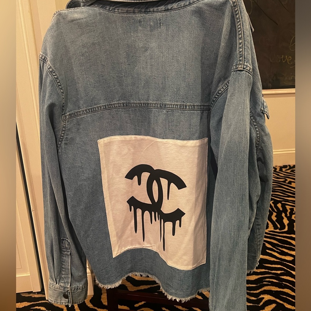 Jean jacket with Chanel print on back